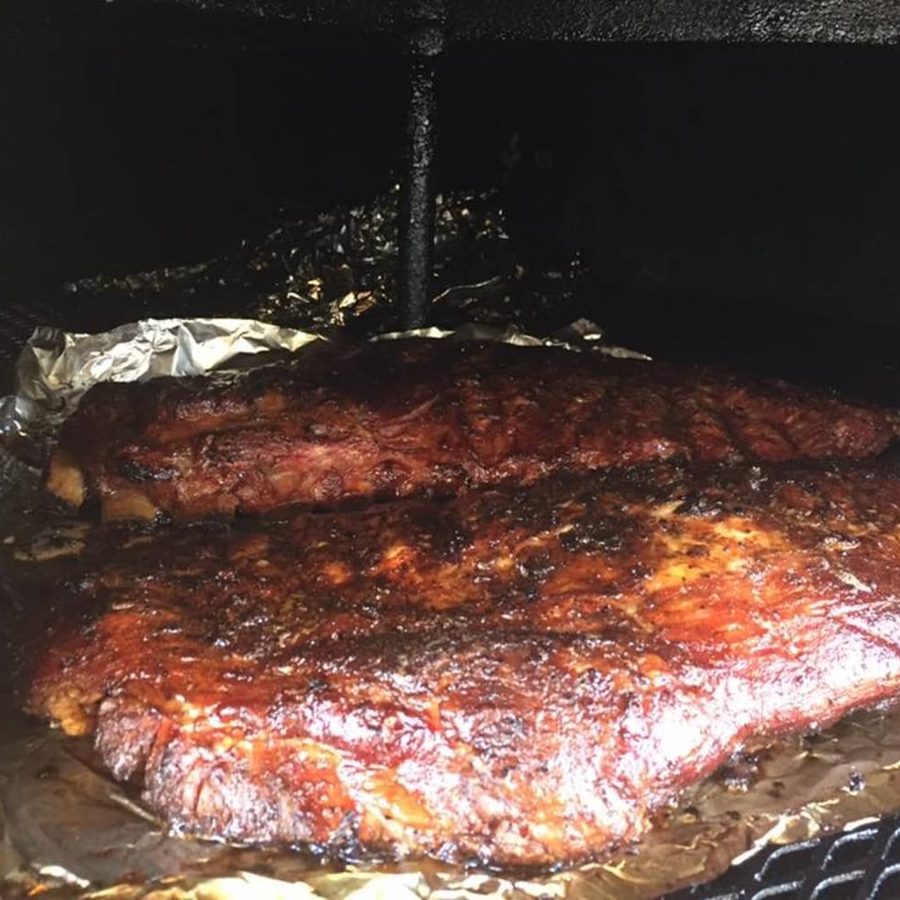 Two racks of ribs finishing in the smoker