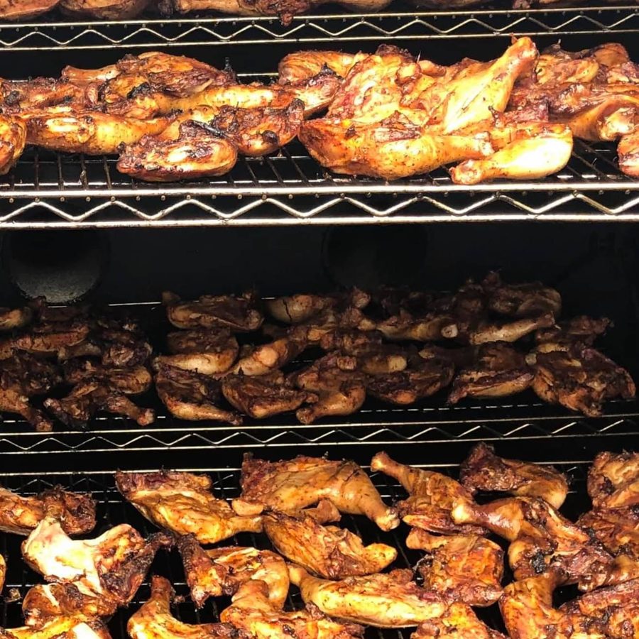 Racks of chicken loaded in the smoker